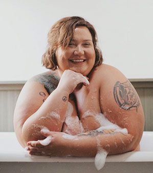 Body positive women with soap on her